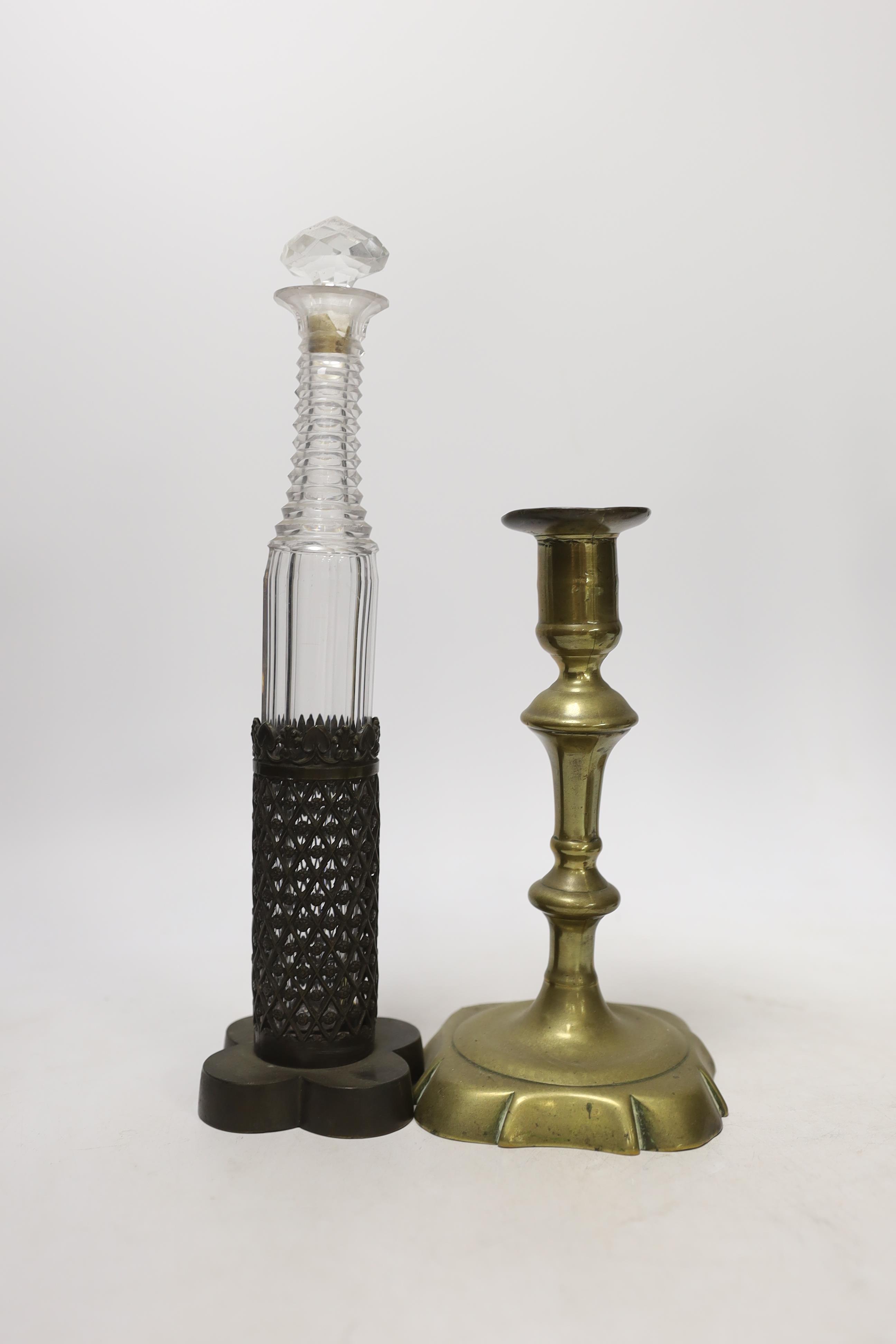 Two mid 19th century prismatic-cut scent bottles in mounts, an Orivit pewter stand and a George II brass candlestick, tallest 28cm